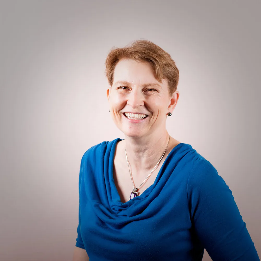 A professional headshot of Charlene